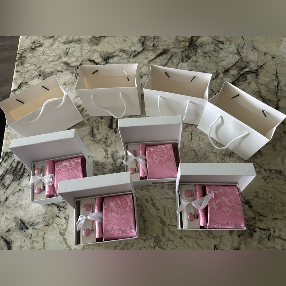 Gift sets of pink silk tie, pocket square, tie clip, & cuff links